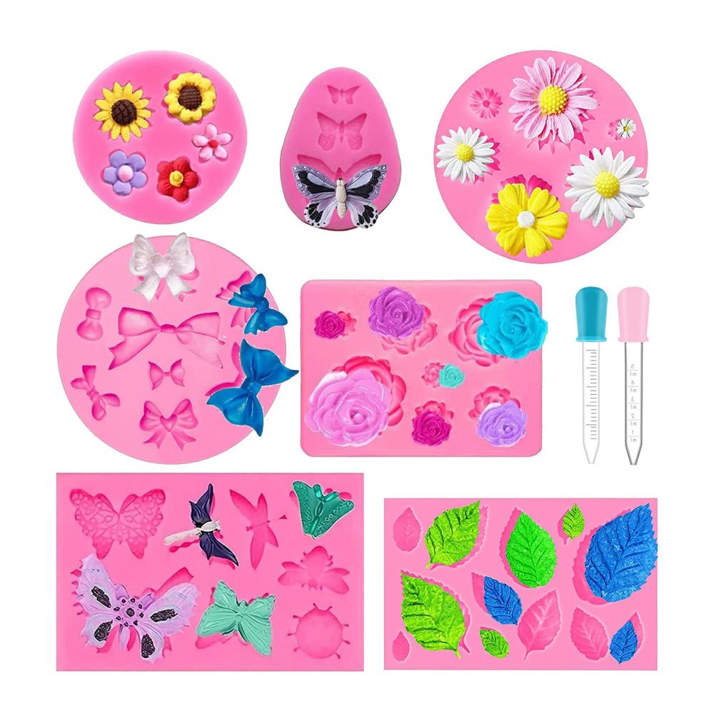 Premium Schokoladenformen Set - 7 Stück Silikonformen für Süßigkeiten Fondant & mehr | Rosen Gänseblümchen Blumen Schmetterling Blätter Libelle Bow | Inklusive 2 Tropfer für perfekte Dekoration