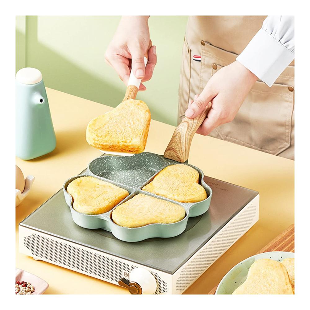 Entdecken Sie die Magie des Kochens mit unserer Eggcelente Pfanne! 4-Tassen Kapazität Antihaftbeschichtung herzförmiges Design für perfekte Omeletts. Gleichmäßige Heizung für köstliche Pfannkuchen. Stilvoller Griff in Grün. Ihre perfekte Küchenlösung