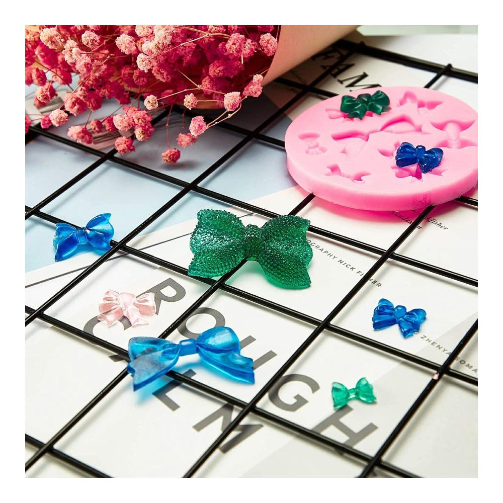 Premium Schokoladenformen Set - 7 Stück Silikonformen für Süßigkeiten Fondant & mehr | Rosen Gänseblümchen Blumen Schmetterling Blätter Libelle Bow | Inklusive 2 Tropfer für perfekte Dekoration
